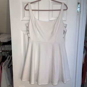 White fit and flare dress with cross detail at sides